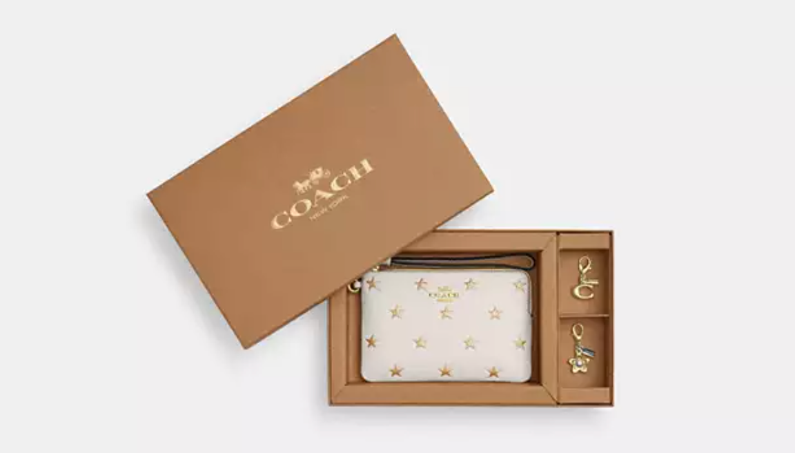 PREVENTA Coach wristlet blanca con estrellas en caja