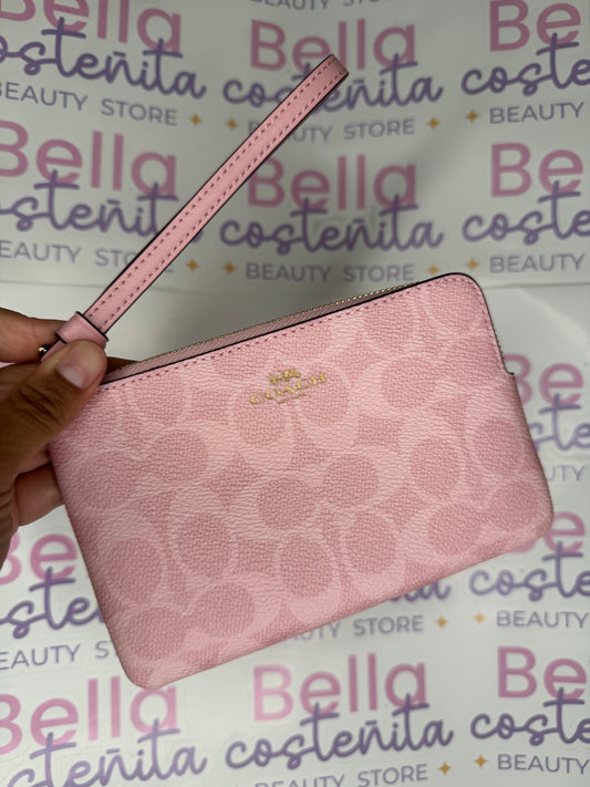 Coach - Wristlet Rosa con monograma